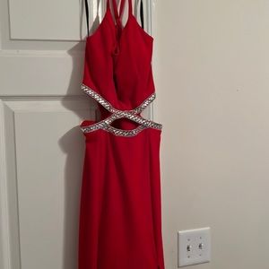 A prom dress in the color red and a size 7.